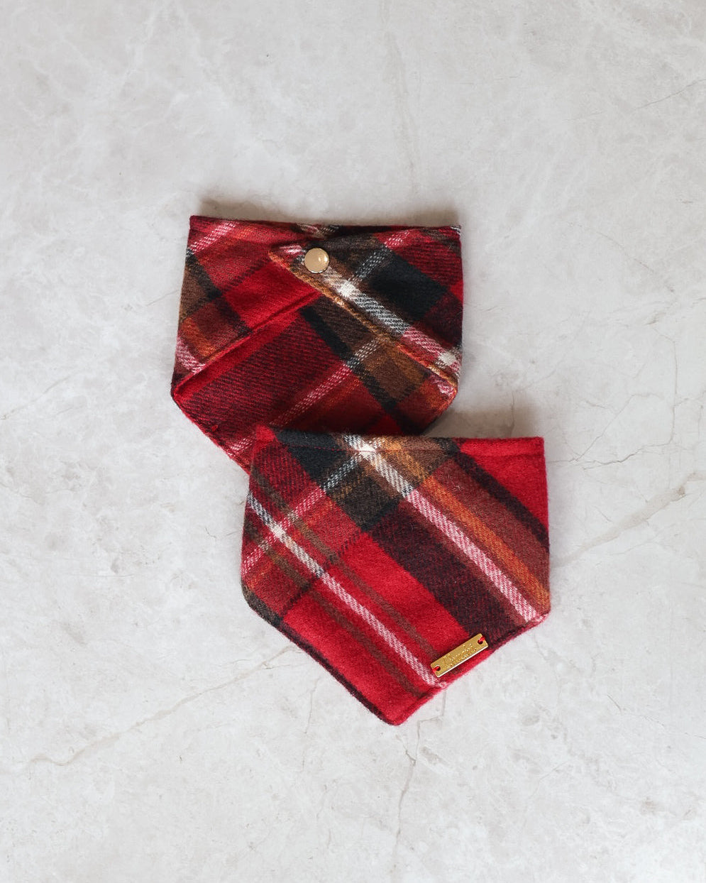 Red plaid dog bandana and gold logo tag on a light gray marbel background. 

cute bandana for dogs
red bandana
soft dog bandana