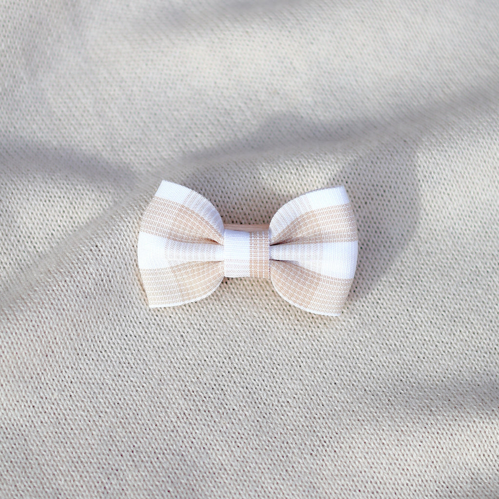 Bow tie on a textured gray fabric background