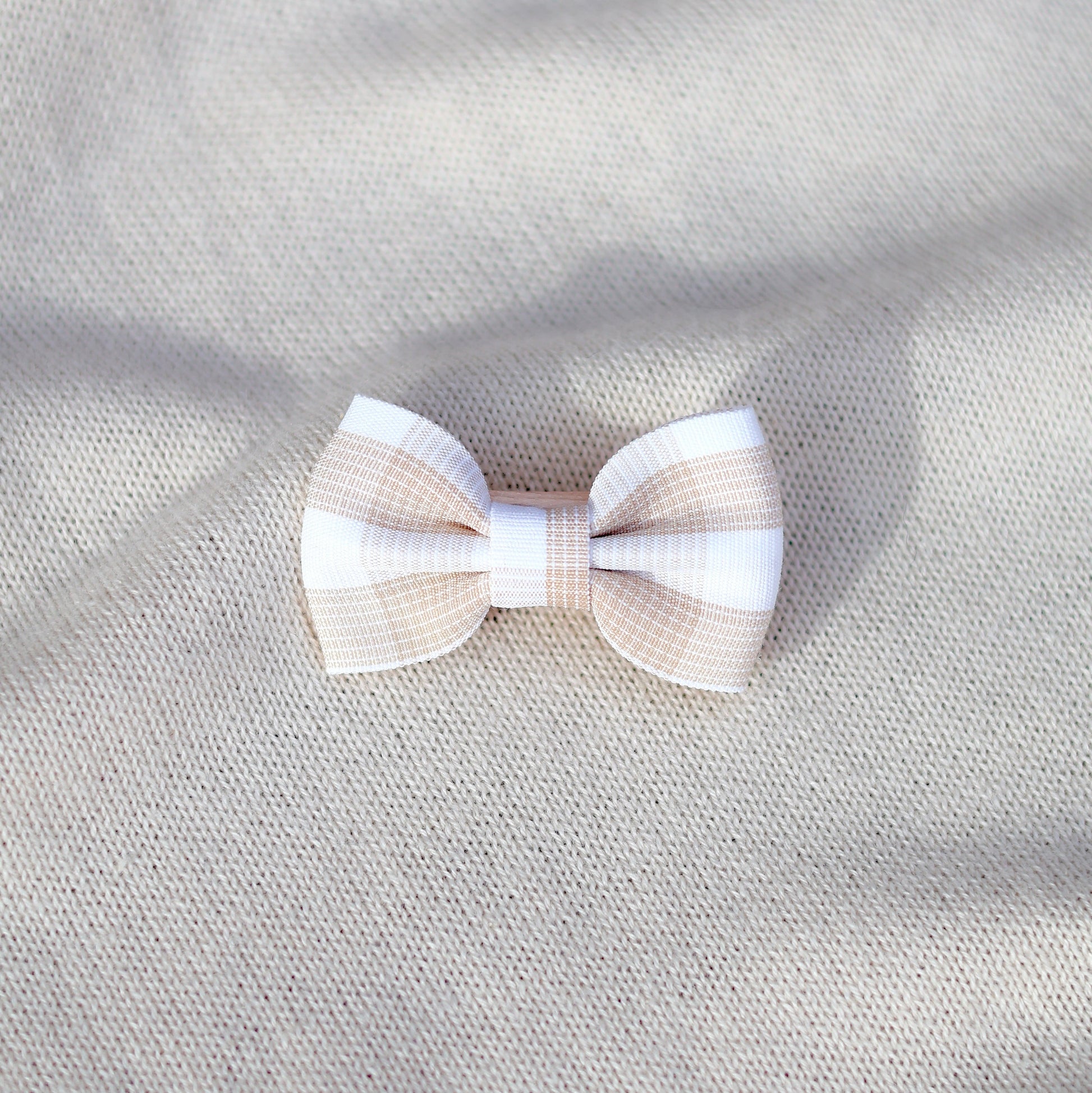 Bow tie on a textured gray fabric background