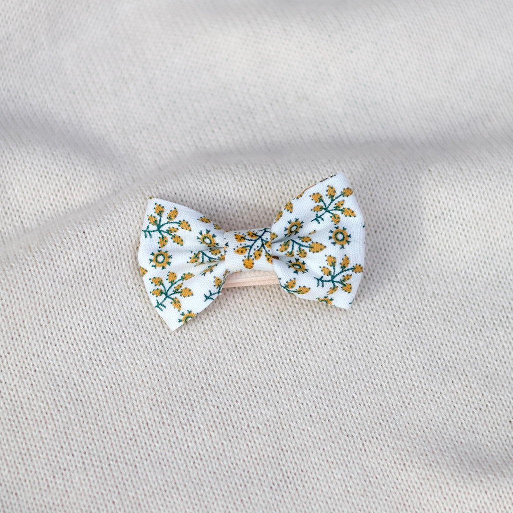 Floral bow tie on a textured gray background