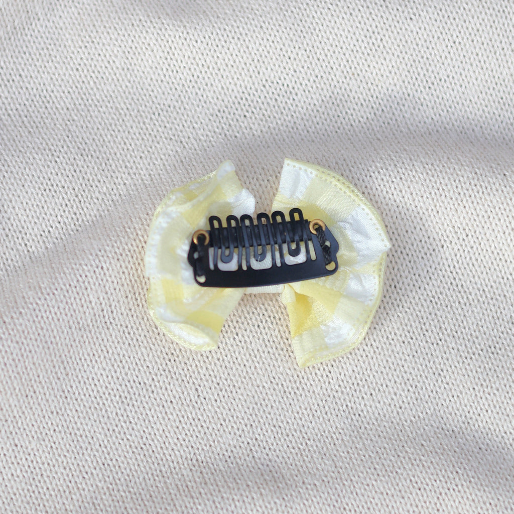 Dental impression tray on a light gray fabric background