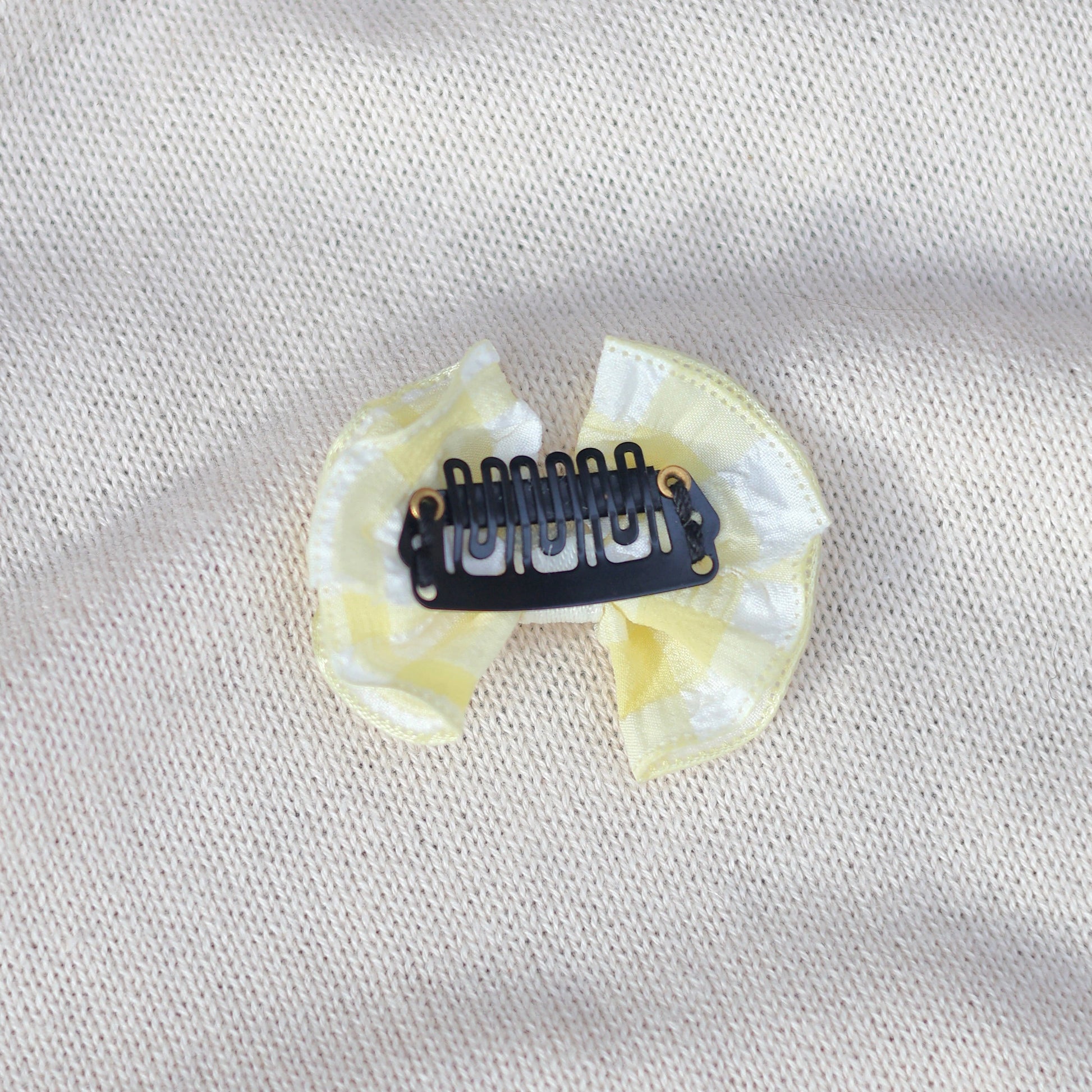 Dental impression tray on a light gray fabric background
